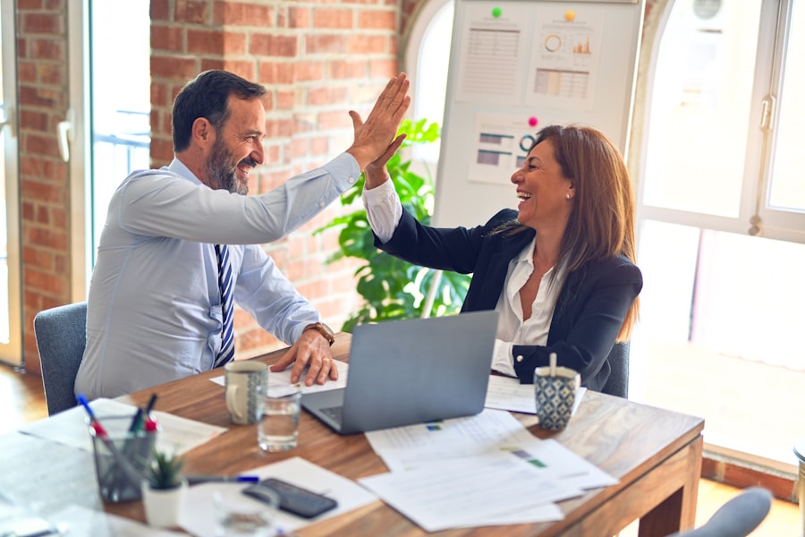 Elite Business Capital advisor celebrating an approval with a client
