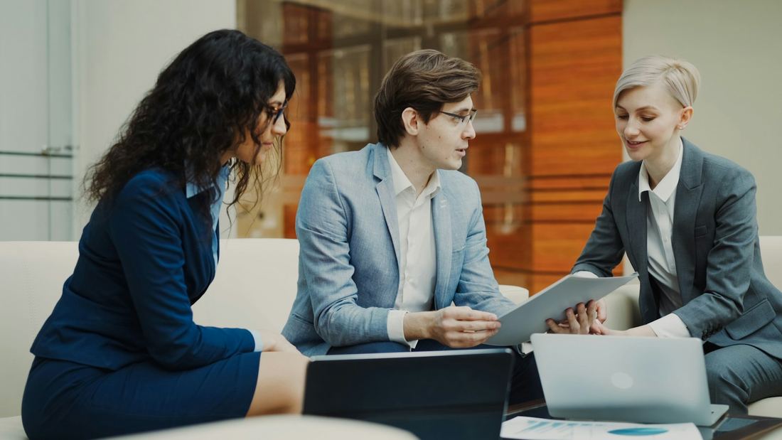 Referral partners reviewing documents with an Elite Business Capital advisor